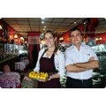Restaurace se stoly a zahrádkou